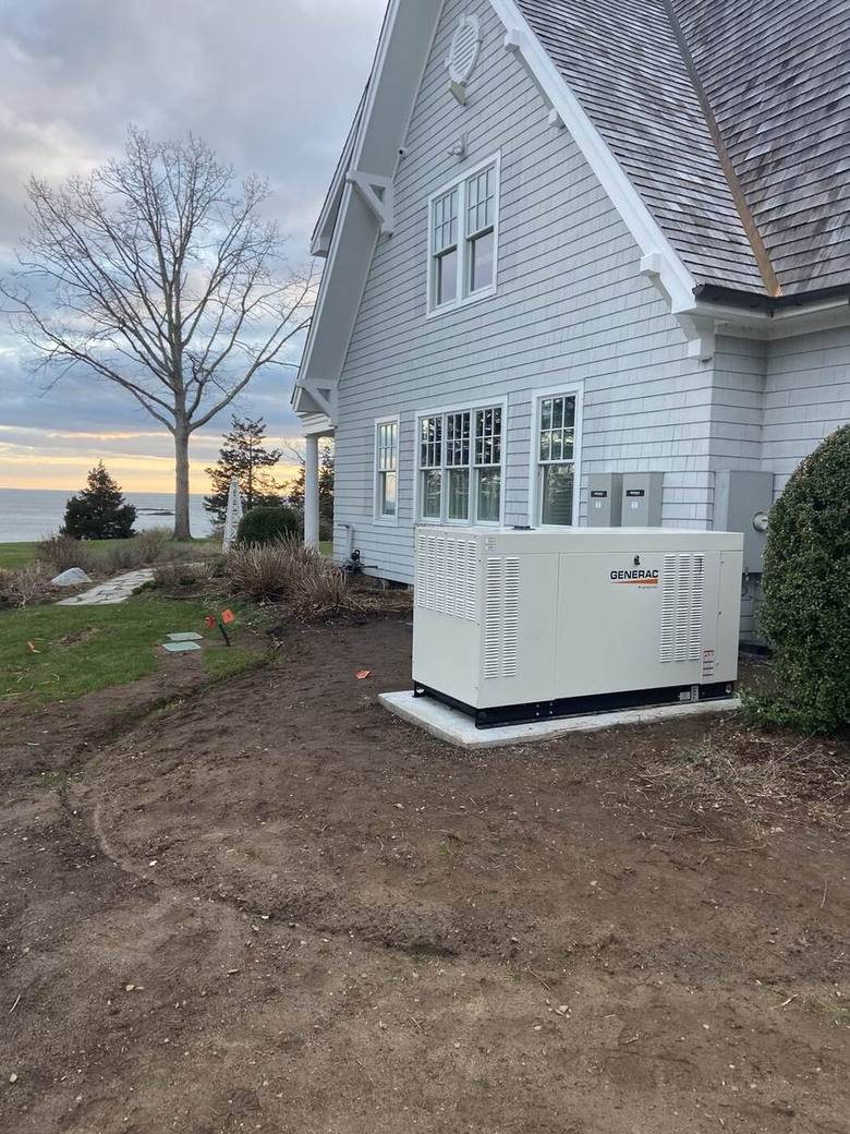 Standby generator installed beside a Connecticut home