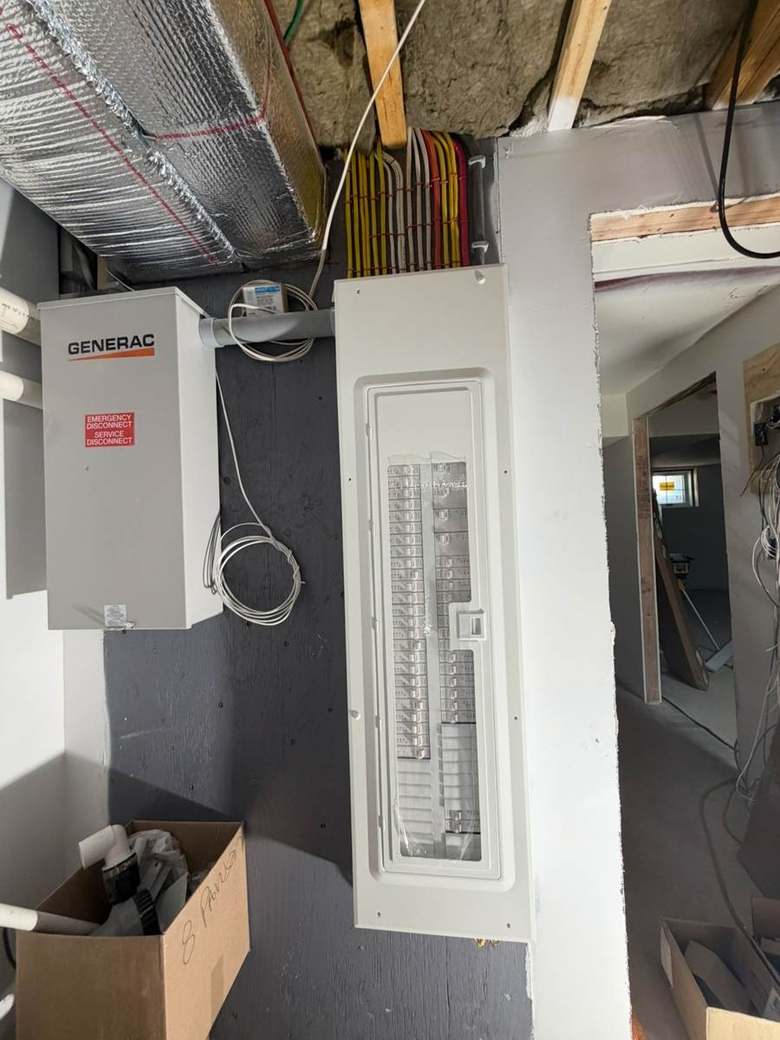 New load center installed alongside a generator service disconnect